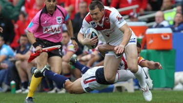 Brett Morris tries to make a break during the 2010 grand final when playing for the Dragons against the Roosters.
