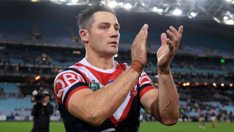 Standing ovation: Cooper Cronk is impressed with the form of opposing halfback Adam Reynolds.