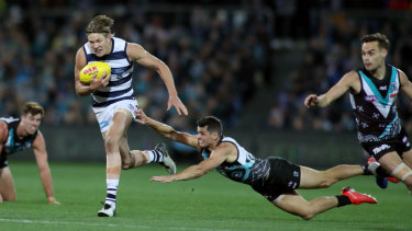 Rhys Stanley of Geelong makes a clean break against Port Adelaide on Saturday night.