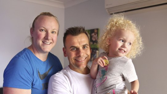 Anthony Matthews with partner Natalie and two-year-old daughter Kayla at their Glendenning home in western Sydney.