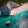 A beach on Kefalonia and the clear emerald blue Ionian Sea. 