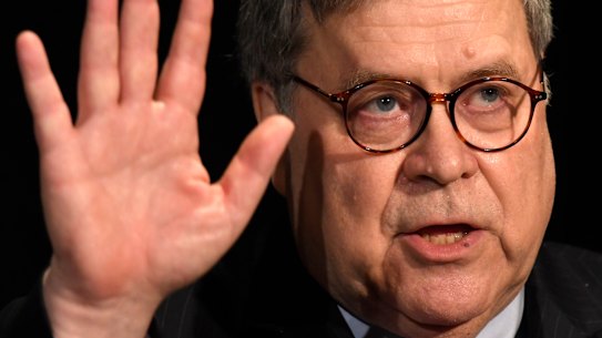Attorney General William Barr waves after speaking at the National Sheriffs' Association Winter Legislative and Technology Conference in Washington.