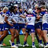 Canterbury Bulldogs celebrate a try against South Sydney Rabbitohs.