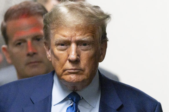Former president Donald Trump returns to the courtroom after a recess during the second day of jury selection at Manhattan.