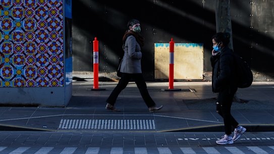 People walk through Melbourne CBD last week.