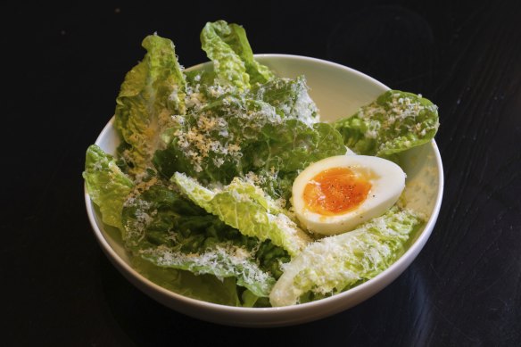 A gem lettuce salad with parmesan and soft eggs accompanies the rib-eye.