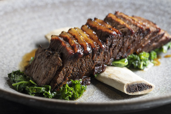 Beef short ribs with sauteed kale.