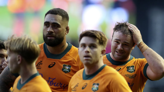 Wallabies captain Harry Wilson and teammates react after the defeat in Scotland.