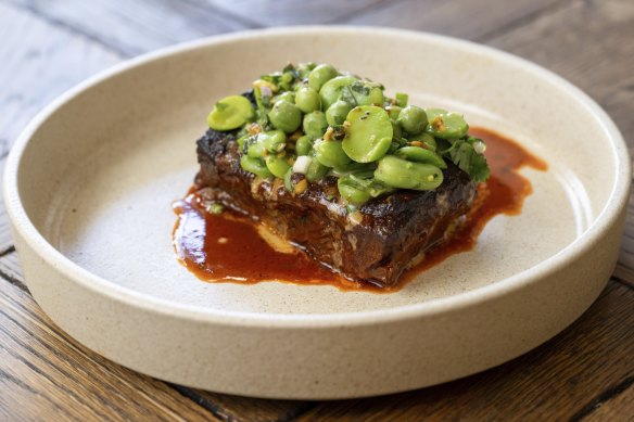 Slow-cooked beef short rib topped with peas and pistachio, the perfect foil for the rich meat.