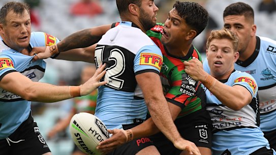 Latrell Mitchell gets an offload away during the win over Cronulla. 