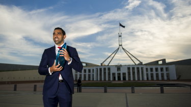 Off-field impact: Adam Goodes accepting his Australian of the Year award in 2014.