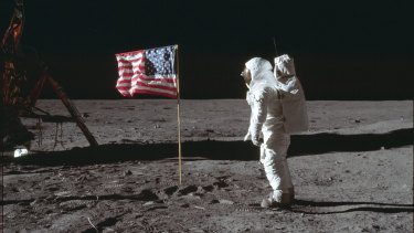 In this July 20, 1969 photo made available by NASA, astronaut Buzz Aldrin Jr. poses for a photograph beside the US flag on the moon during the Apollo 11 mission. 