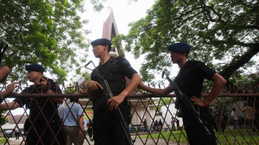 Indonesian police officers guard a church compound following an attack in Medan in 2016.