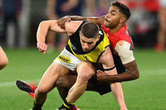 Dion Prestia is tackled by Kysaiah Pickett.