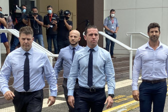Constable Zachary Rolfe (centre) leaving court on the first day of his trial for the murder of 19-year-old Kumanjayi Walker. 