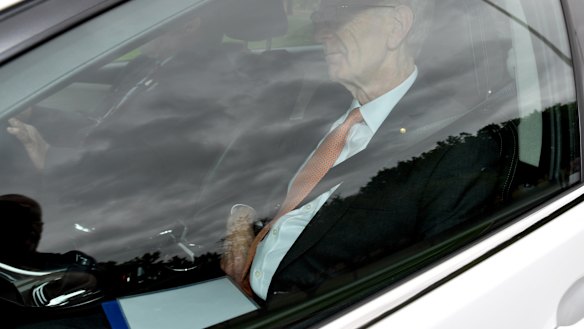 Commissioner Kenneth Hayne arrives at government house with the final report of the royal commission. 