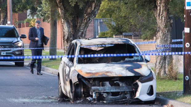 A burnt-out car at the scene of an overnight shooting in Bray Street, Reservoir. 