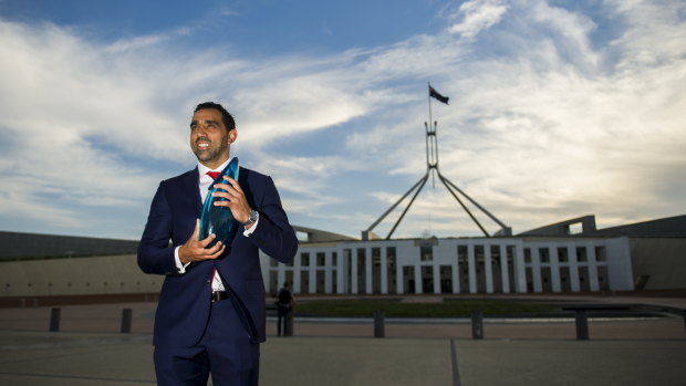 Off-field impact: Adam Goodes accepting his Australian of the Year award in 2014.