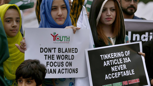 Members of the Youth Forum for Kashmir, a civil society group, protest against India's policy in Islamabad, Pakistan.