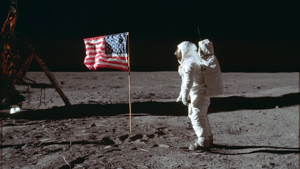 In this July 20, 1969 photo made available by NASA, astronaut Buzz Aldrin Jr. poses for a photograph beside the US flag on the moon during the Apollo 11 mission. 