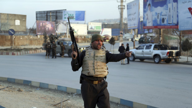 Afghan security forces arrive at the site of an explosion and attack by gunmen, in Kabul.