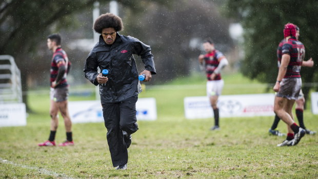 Henry Speight running water for the Gungahlin Eagles on a day off from Brumbies duties.