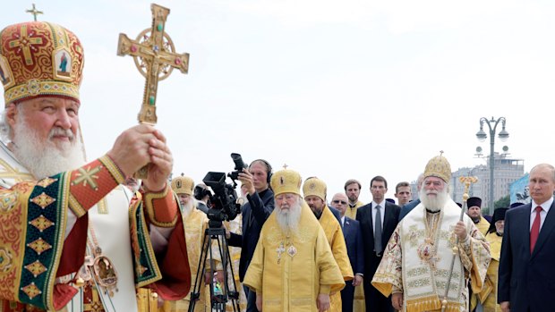 Russian Orthodox Church Patriarch Kirill, left, leads a religion service as Russian President Vladimir Putin, right, attends a ceremony marking the 1030th anniversary of the adoption of Christianity by Prince Vladimir, the leader of Kievan Rus, a loose federation of Slavic tribes that preceded the Russian state in Moscow, Russia.