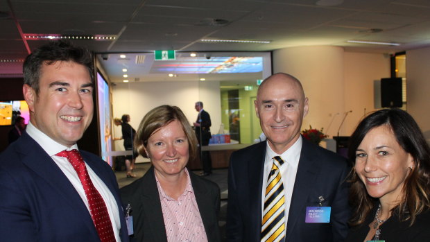 Brendon Riley (middle right) has been in charge of steadying the ship at Telstra Health.