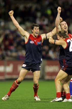 Jeff White (left) celebrates at the end of a win in 2005.