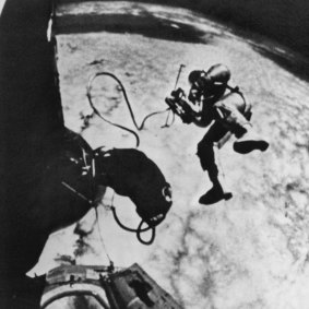 Astronaut Ed White operates his oxygen gun to manoeuvre himself around the Gemini 4 spacecraft.