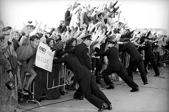 Crowd control: fans await the arrival of Ringo Starr in 1964 at Sydney Airport.