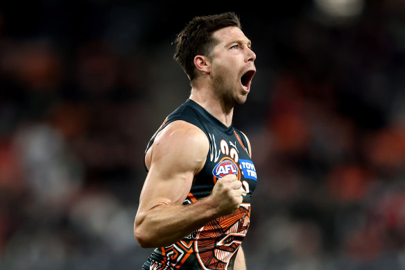 Toby Greene of the Giants celebrates after kicking a goal.