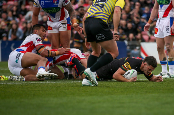 Nathan Cleary burrows over to score against the Knights.