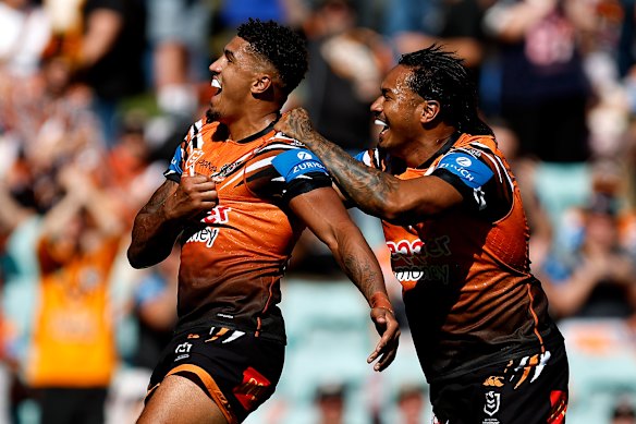 Kai Pearce-Paul celebrates a try in the Tigers’ opening match against North Queensland.