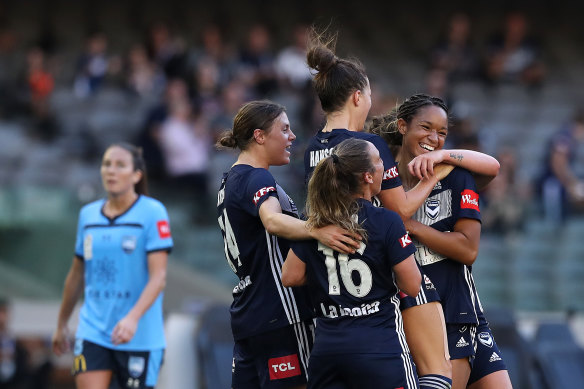 Melbourne Victory celebrate a goal against Sydney FC in round 14. 