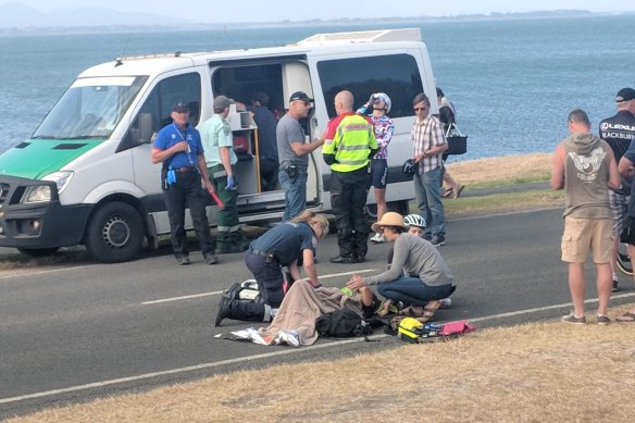 Shannon Malseed receives roadside medical attention following a crash at the end of stage two of the Bay Crits. 