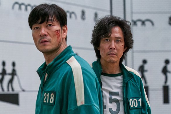 Lee Jung-jae, right, in Squid Game with co-star Park Hae-soo.