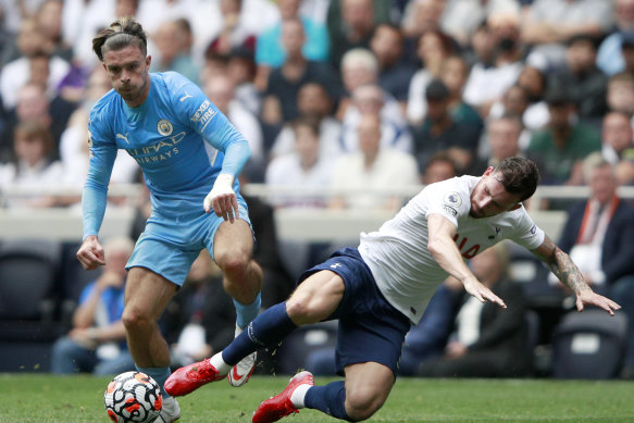Jack Grealish, on his Premier League debut for Manchester City, is challenged by Tottenham’s Pierre-Emile Hojbjerg.