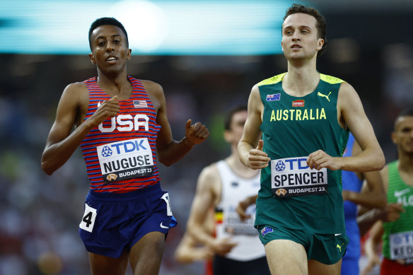 Australia’s Adam Spencer ahead of US runner Yared Nuguse in heat four of the 1500m at the world championships in Hungary.