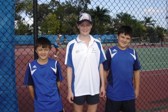 A young Adam Walton (pictured at left) with his brother Jack (right) and Hannah Casswell (centre).