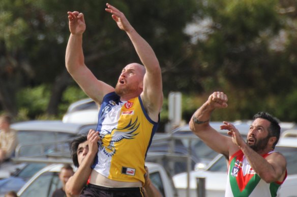 Jarryd Roughead soars for a mark in the Sea Eagles’ forward line.