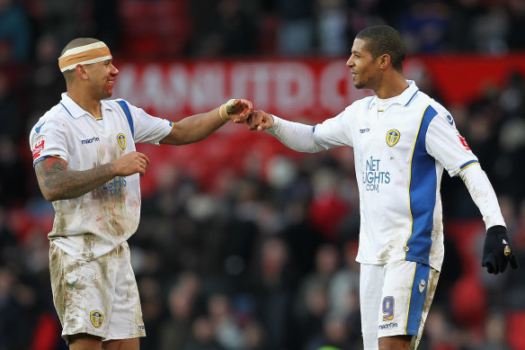 Patrick Kisnorbo (left) during his days as a rugged centre-back for Leeds.