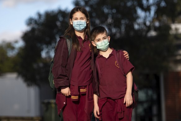 Blackburn Primary School students Alice, nine, and her brother Ben, six, are happy to mask up at school.