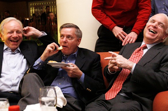 (From left) Senators Lindsey Graham, Joe Lieberman and John McCain watch the Super Bowl at a hotel lobby bar in 2008. Graham had a passion for Chick-fil-A, Baileys liqueur, and almond schnapps.