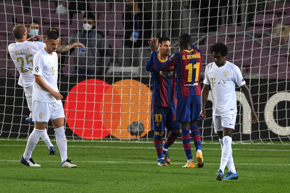 Lionel Messi and Ousmane Dembele celebrate the latter's goal in the 5-1 rout of Ferencvaros.