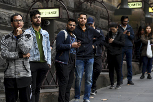 International students queuing outside Melbourne Town Hall for food vouchers in May.