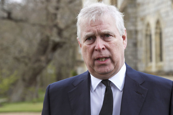 Prince Andrew speaks outside a memorial service for Prince Philip earlier this year, in a rare public appearance.