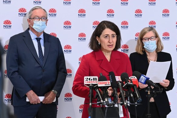 Bleak: NSW Health Minister Brad Hazzard, Premier Gladys Berejiklian and Chief Health Officer Kerry Chant on Friday.