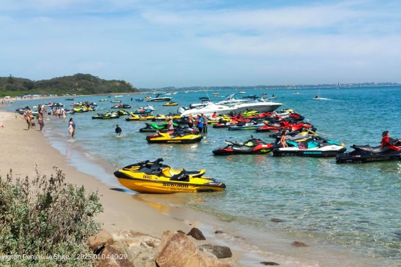 Jet-skis lined up at a beach in Rye.