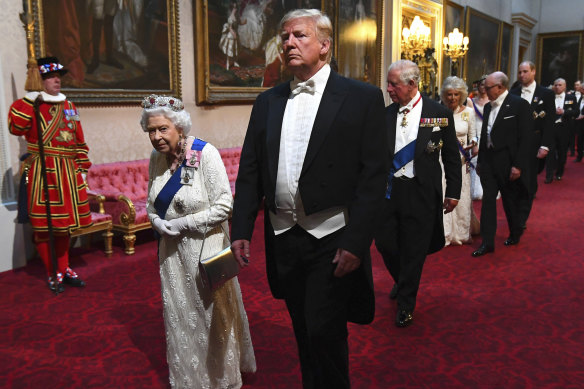 The Queen and president Donald Trump arrive with others at Buckingham Palace ahead of a state banquet in 2019.